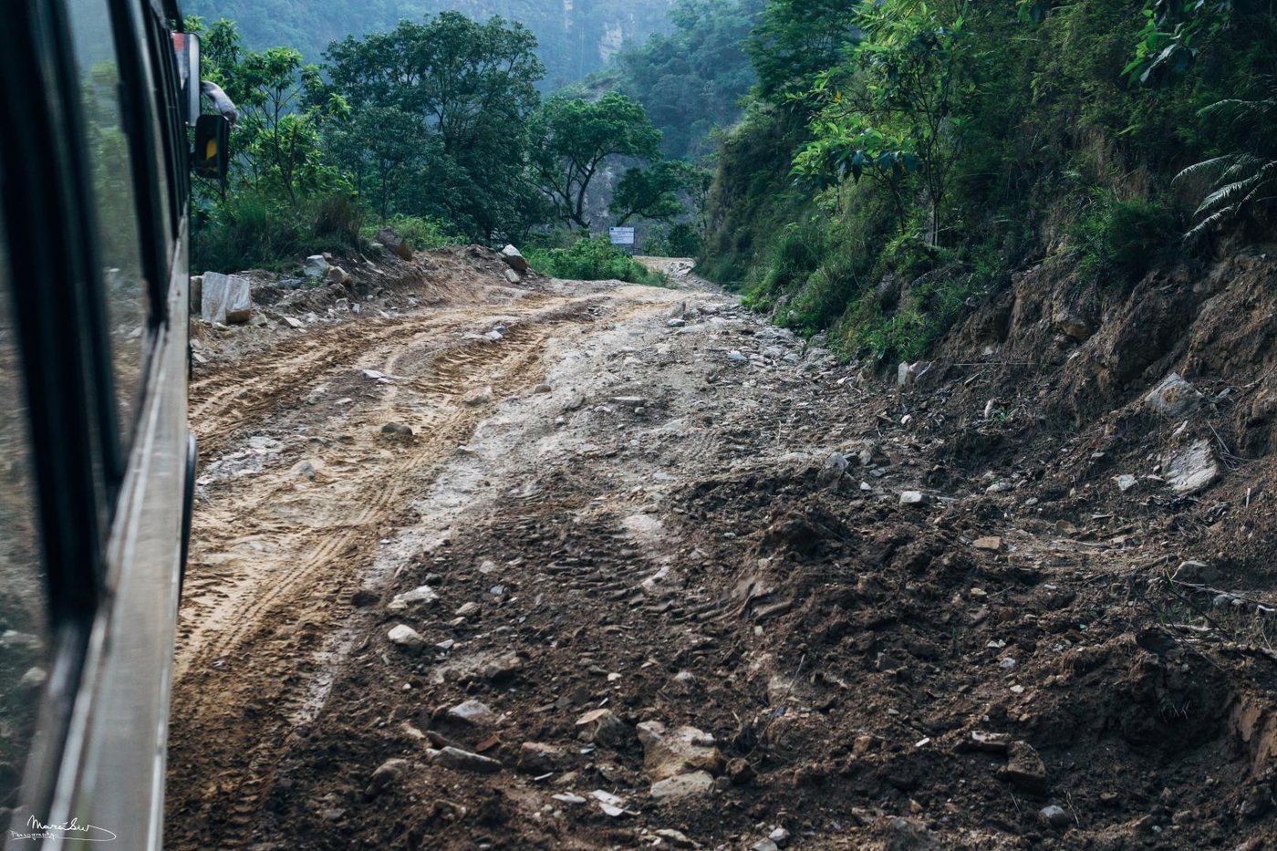 A dirt road winding out of the valley